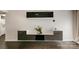 Modern living room features stylish wall mounted shelving, luxury vinyl plank flooring, and neutral paint at 211 Heritage Blvd # 309, Fort Mill, SC 29715
