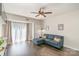 Inviting living room features a comfortable blue sectional sofa, ceiling fan and lots of natural light at 211 Heritage Blvd # 309, Fort Mill, SC 29715