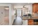This living space features luxury vinyl plank flooring, with an adjacent kitchen and living room at 211 Heritage Blvd # 309, Fort Mill, SC 29715