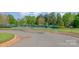 Community tennis courts with surrounding trees and sidewalks at 211 Heritage Blvd # 309, Fort Mill, SC 29715