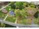 An aerial view showcasing the property's mature trees, landscaping, and convenient road access at 2131 Wildlife Rd, Charlotte, NC 28214