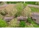 Aerial view of a home surrounded by mature trees with lush greenery and a tranquil setting at 2131 Wildlife Rd, Charlotte, NC 28214