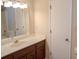 Bathroom featuring a vanity with a sink, mirror, and a closet at 2131 Wildlife Rd, Charlotte, NC 28214