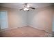 Comfortable bedroom featuring carpet and ceiling fan at 2131 Wildlife Rd, Charlotte, NC 28214