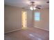 A bright bedroom with neutral carpet and walls and a doorway to a bathroom at 2131 Wildlife Rd, Charlotte, NC 28214