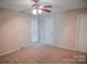 Neutral bedroom with large window and neutral carpet at 2131 Wildlife Rd, Charlotte, NC 28214