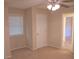 A bedroom with neutral walls and carpet, a closet, and a window at 2131 Wildlife Rd, Charlotte, NC 28214