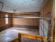 Unfinished garage space with exposed brick and an automatic garage door at 2131 Wildlife Rd, Charlotte, NC 28214