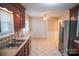 Open kitchen with stainless steel appliances, double sink, and large pantry at 2131 Wildlife Rd, Charlotte, NC 28214