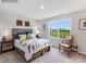 This bedroom features a large window, letting natural light illuminate the stylish decor, including art and comfortable seating at 2165 Trollinger Dr, Catawba, NC 28609