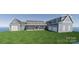 New construction of a beautiful two-story home with blue siding and a two-car garage on a lush green lawn at 2334 Bridgewater Rd # 6, Rock Hill, SC 29730