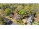 Aerial view of the home showcasing its location within a tree-filled neighborhood at 2439 Heathershire Ln, Matthews, NC 28105
