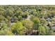 Aerial view of a residential area with tree-lined streets at 2439 Heathershire Ln, Matthews, NC 28105