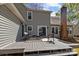 Spacious back deck with outdoor seating, perfect for relaxing and entertaining, with a partial view of the backyard at 2439 Heathershire Ln, Matthews, NC 28105
