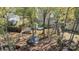 Aerial view of a backyard featuring a deck, shed, gazebo, and a fire pit at 2439 Heathershire Ln, Matthews, NC 28105