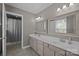This bathroom has a double sink vanity and a separate toilet and shower room at 2439 Heathershire Ln, Matthews, NC 28105
