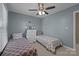 This bedroom features two twin beds with matching decor and plenty of natural light at 2439 Heathershire Ln, Matthews, NC 28105