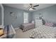 This bedroom features two twin beds with matching decor and plenty of natural light at 2439 Heathershire Ln, Matthews, NC 28105