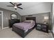 Bedroom with large bed, ceiling fan, carpet, dresser, and night stand at 2439 Heathershire Ln, Matthews, NC 28105