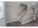 Welcoming entryway with hardwood floors, a staircase, and neutral decor offering a warm and inviting ambiance at 2439 Heathershire Ln, Matthews, NC 28105