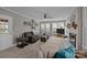 Comfortable living room boasts a brick fireplace, large windows, and plush seating at 2439 Heathershire Ln, Matthews, NC 28105