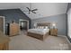This main bedroom has a vaulted ceiling, a king bed, and plenty of space at 2439 Heathershire Ln, Matthews, NC 28105