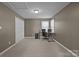 This office features a desk and chair setup, ample lighting, and plenty of space at 2439 Heathershire Ln, Matthews, NC 28105