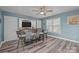 Modern rec room with a wet bar, plenty of seating and a large window at 2439 Heathershire Ln, Matthews, NC 28105