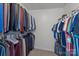 This walk-in closet has ample hanging space and shelving for maximum storage at 2439 Heathershire Ln, Matthews, NC 28105