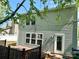 Exterior view of a home with a deck, showing gray siding, windows and door at 2752 Bramble Ridge Ct, Charlotte, NC 28215