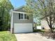 Charming two-story home featuring a attached garage, neutral siding, and manicured lawn at 2752 Bramble Ridge Ct, Charlotte, NC 28215
