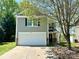 Inviting two-story home with a manicured front yard, attached garage, and covered entryway at 2752 Bramble Ridge Ct, Charlotte, NC 28215