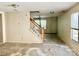 Spacious living room with staircase and natural light at 2752 Bramble Ridge Ct, Charlotte, NC 28215