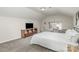 Bedroom with carpet floors, TV, window, a bed and a desk with a bench at 3009 Early Rise Ave, Indian Trail, NC 28079
