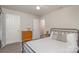 Well-lit bedroom featuring carpet flooring, a window, a dresser, and a metal bed frame at 3009 Early Rise Ave, Indian Trail, NC 28079