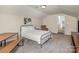 Charming bedroom featuring cozy decor, a metal frame bed, and soft natural light at 3009 Early Rise Ave, Indian Trail, NC 28079