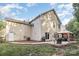 Rear exterior view of a two-story home with a sliding glass door leading to the patio at 3009 Early Rise Ave, Indian Trail, NC 28079