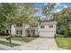 Charming two-story home with a two-car garage and covered porch, framed by mature trees at 3009 Early Rise Ave, Indian Trail, NC 28079
