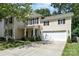Charming two-story home featuring a covered porch, a two-car garage, and manicured landscaping at 3009 Early Rise Ave, Indian Trail, NC 28079
