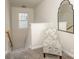Bright hallway with a window, chair, mirror and a staircase leading to another level at 3009 Early Rise Ave, Indian Trail, NC 28079