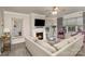Cozy living room with a fireplace, comfortable seating, and lots of natural light at 3009 Early Rise Ave, Indian Trail, NC 28079