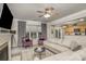 Inviting living room featuring a cozy seating area, ceiling fan, and an open layout to the kitchen at 3009 Early Rise Ave, Indian Trail, NC 28079