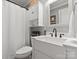 Modern bathroom with white vanity, vessel sink, and decorative mirror for a relaxing retreat at 3020 Salmon River Dr, Monroe, NC 28110