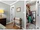 Spacious walk-in closet with custom shelving and organization system in this well-appointed home at 3020 Salmon River Dr, Monroe, NC 28110