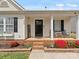 Welcoming front porch with chairs and a 
