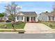 Charming single-story home featuring a well-manicured lawn, concrete driveway, and cozy front porch at 3020 Salmon River Dr, Monroe, NC 28110