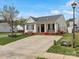 Inviting single-story home with a spacious concrete driveway, charming front porch, and well-maintained landscaping at 3020 Salmon River Dr, Monroe, NC 28110
