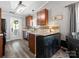 Bright kitchen featuring granite countertops, an island, and an adjacent dining area at 3020 Salmon River Dr, Monroe, NC 28110
