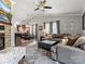 Open-concept living room with a fireplace, comfortable seating, and seamless flow to the dining area at 3020 Salmon River Dr, Monroe, NC 28110