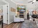 Cozy living room featuring a fireplace, comfortable seating, and seamless flow to the dining area at 3020 Salmon River Dr, Monroe, NC 28110